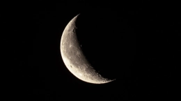 Waning crescent moon in sky close-up. Earth satellite