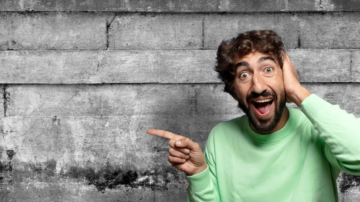 Excited man having idea, pointing