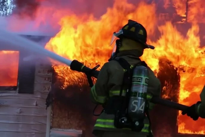 A firefighter fights a fire with the confidence and bravery of an Aries.