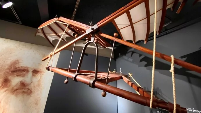 Leonardo da Vinci with a model of his flying machine