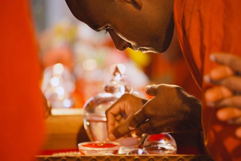 A monk, focused on task of making tea